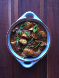 Mushroom Masala in a baby blue dish with handles